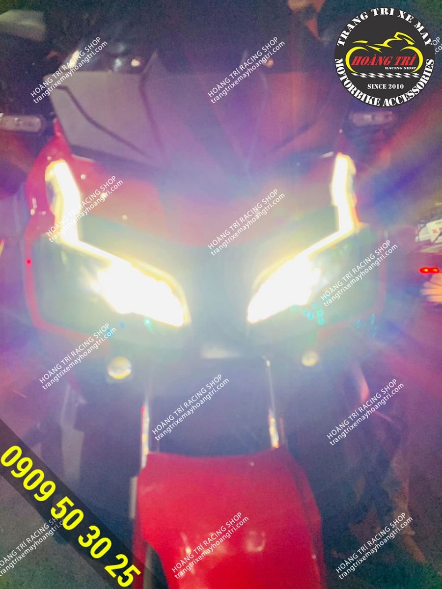 Kenzo Z20 lights are mounted on both sides of the ADV 150 . front fork