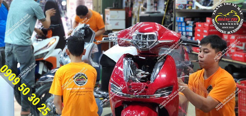 Construction staff gluing Pega-S electric motorbike