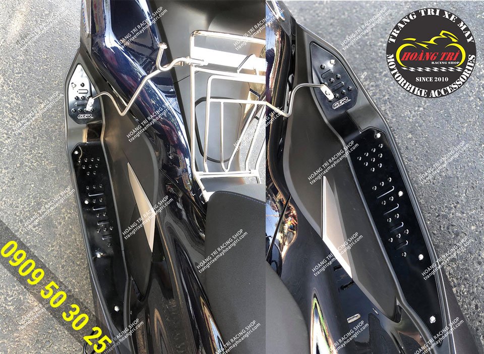 Black CNC aluminum GTR footrest mounted on PCX 2018