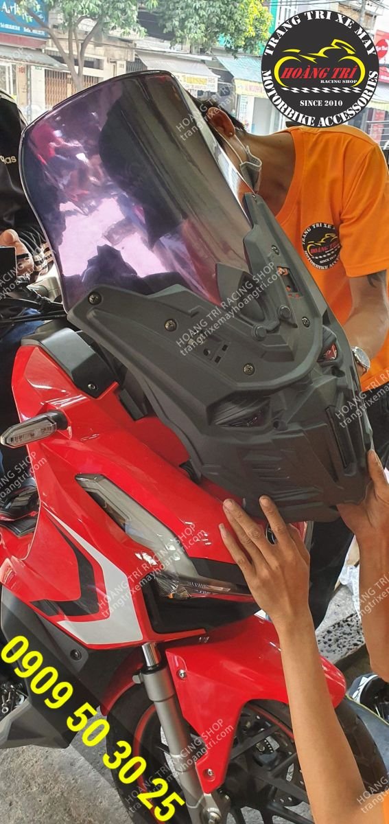 The red ADV 150 is wearing a Black Devil mask