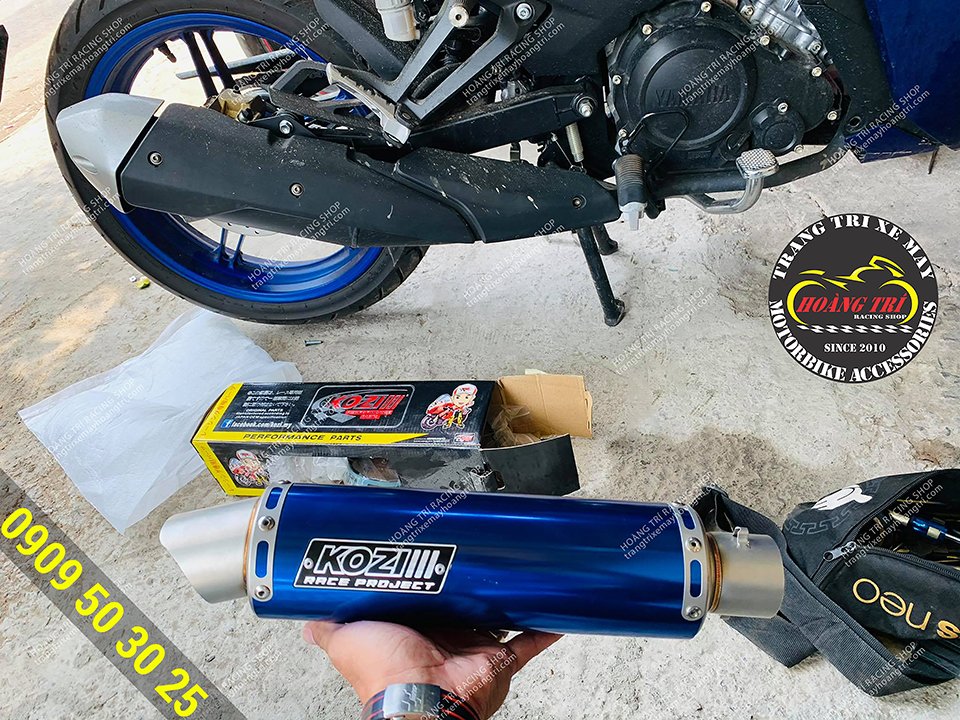 On hand, a blue Kozi exhaust can of GP in the same tone as the car