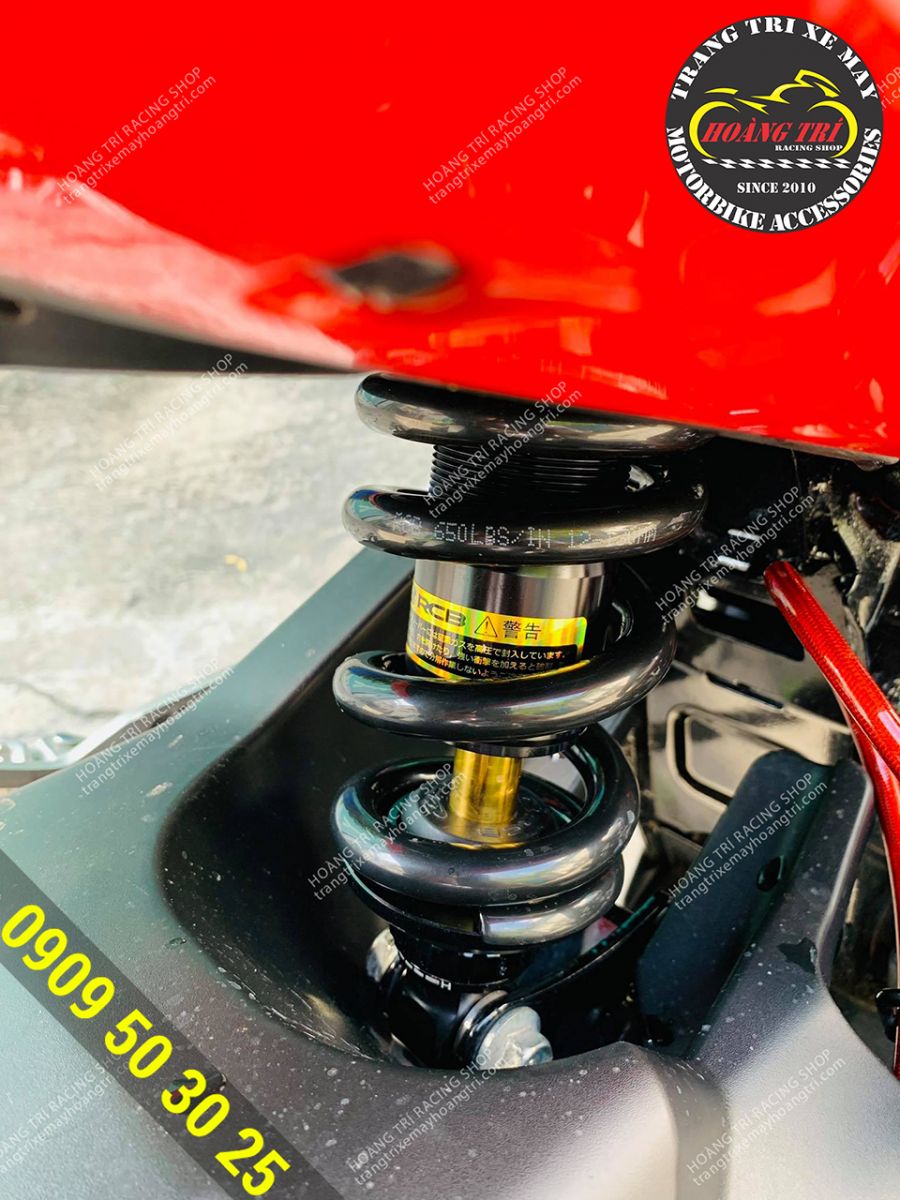 Close-up of Racing Boy S2 gold fork mounted on Honda MSX