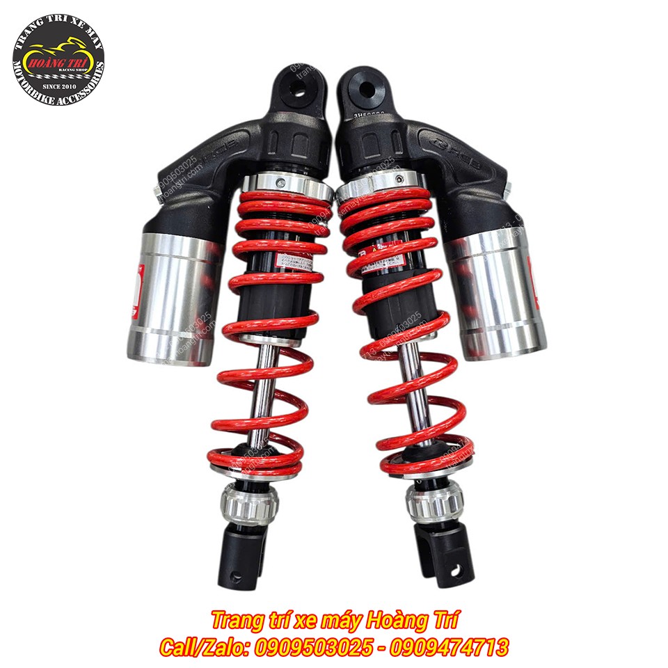 Phối màu nổi bật với lò xo đỏ và bình dầu bạc tạo điểm nhấn thu hút