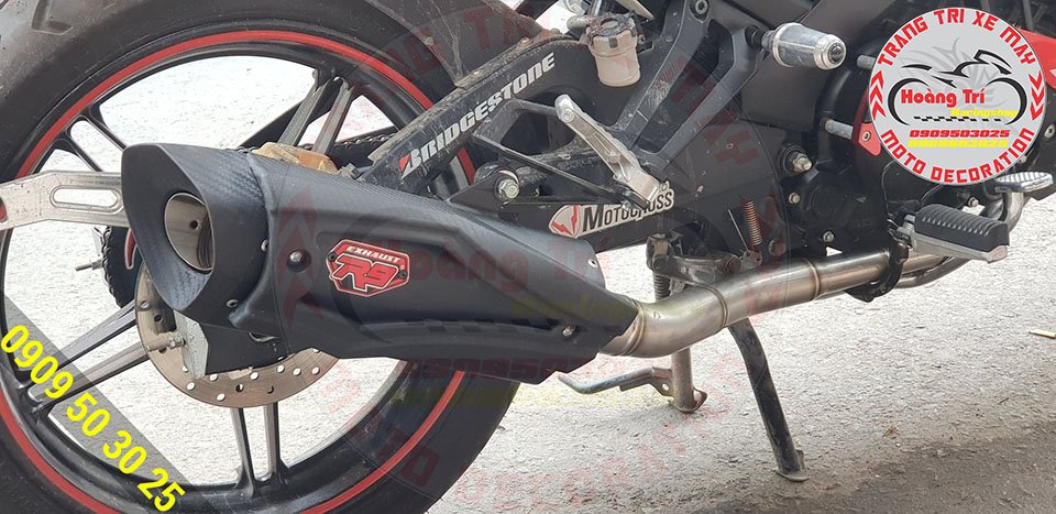 Close-up of R9 exhaust with big logo in the middle