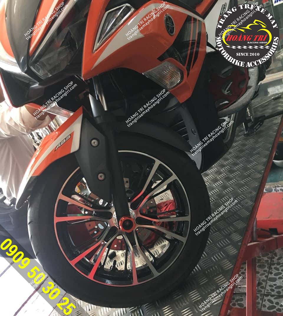 Close-up details of the front CZ wheels fitted to the black orange NVX