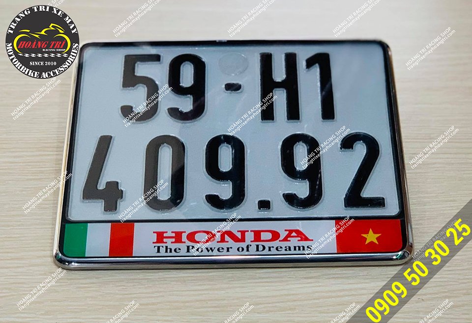 Close-up of the stainless steel mound number plate frame with logo