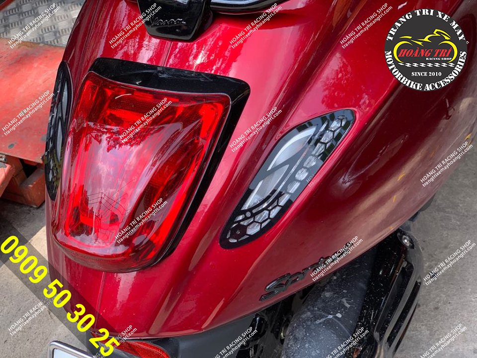 Detailed close-up of the rear lights with honeycomb motifs